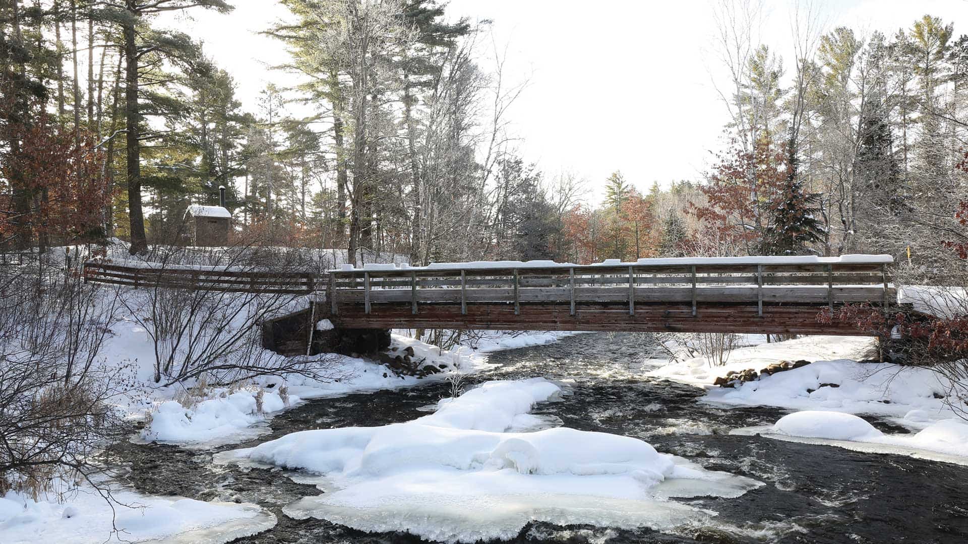 A bridge over a snow covered creek
