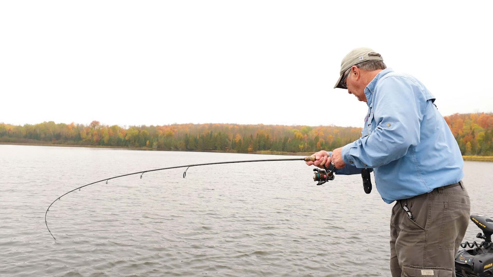 Reeling in a catch at Round Lake during fall