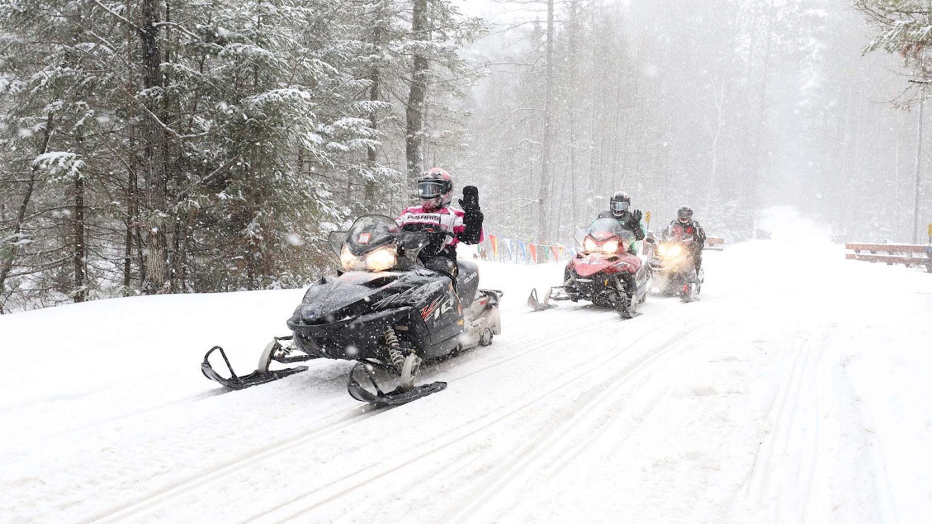 Group snowmobiling the trails
