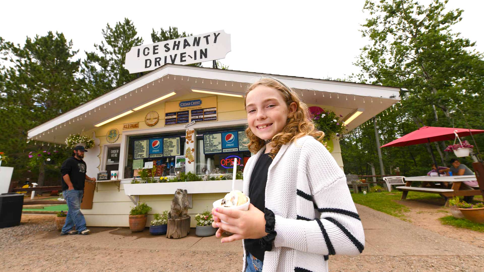 Girl eating ice cream at Ice Shanty Drive-In Boulder Junction Wisconsin