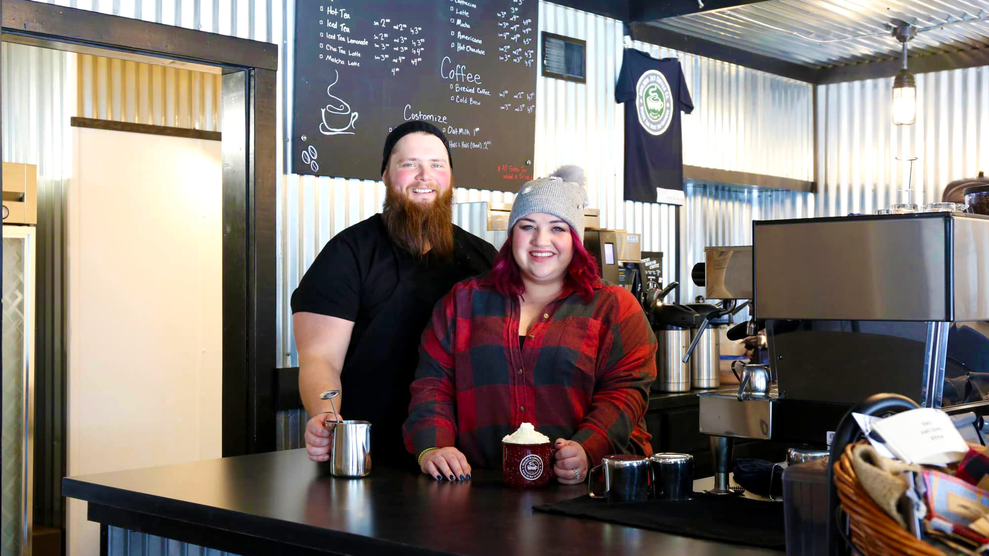 Owners at counter of Boulder Junction Coffee Company in Boulder Junction