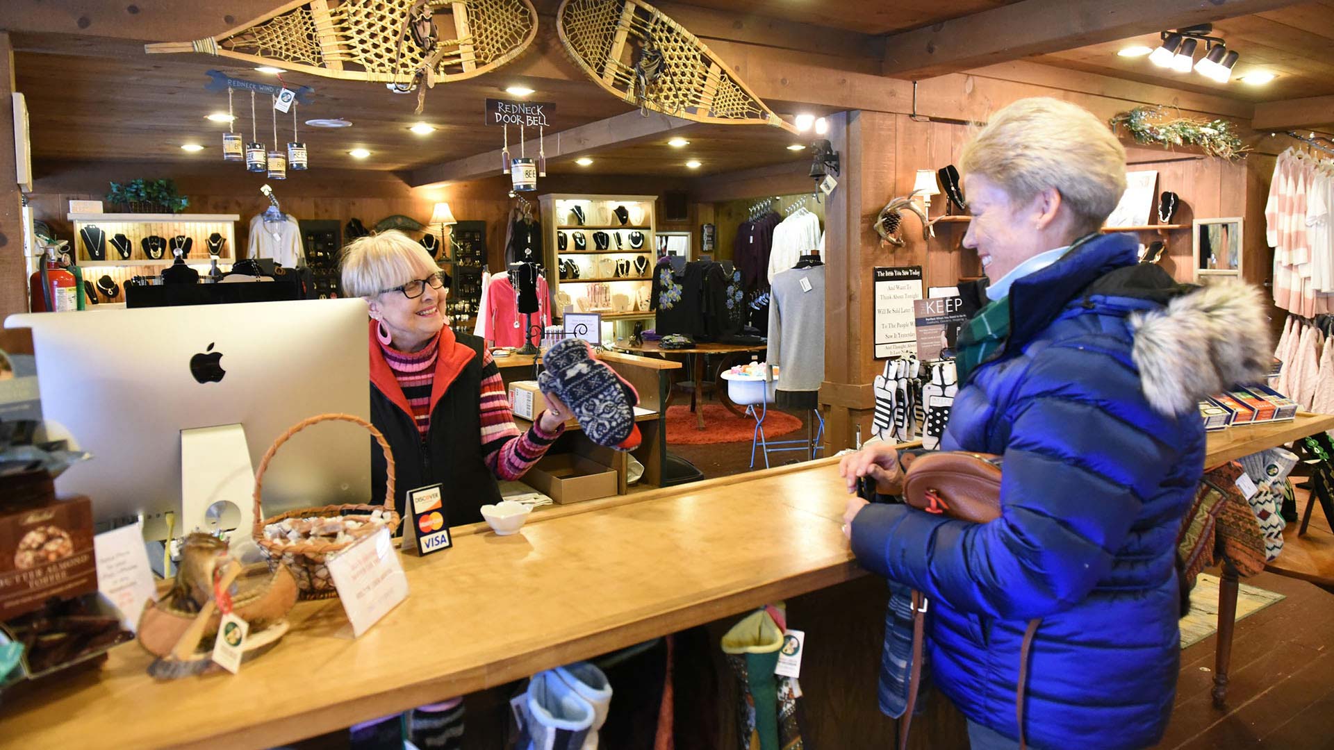 Customer checking out at Boulder Junction Trading Company