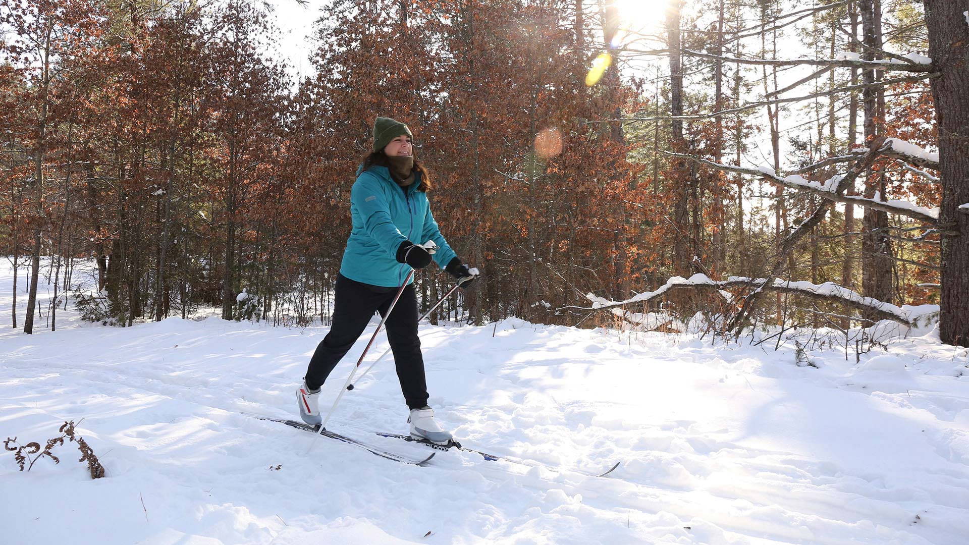 A woman cross-country skiing at Camp Manitowish